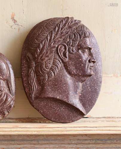 A LARGE CARVED RED PORPHRITIC STONE CAMEO, IN THE ITALIAN GR...