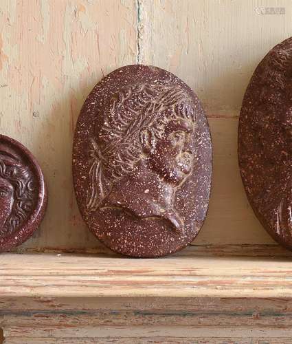 A CARVED RED PORPHRITIC STONE CAMEO, IN THE ITALIAN GRAND TO...