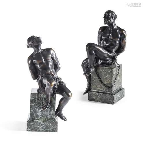 A PAIR OF BRONZE STATUETTES DEPICTING CHAINED BARBARY PIRATE...