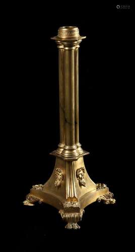 A LATE REGENCY GILT BRASS LAMP BASE, IN THE MANNER OF BULLOC...