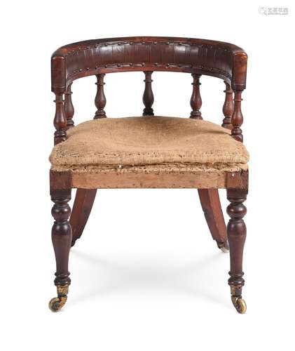 AN EARLY VICTORIAN WALNUT LIBRARY ARMCHAIR, CIRCA 1850