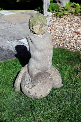 A CARVED STONE FIGURE OF A TRITON, 18TH CENTURY