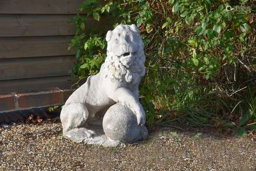 A NORTH ITALIAN CARVED MARBLE FIGURE OF A SEATED LION, PROBA...