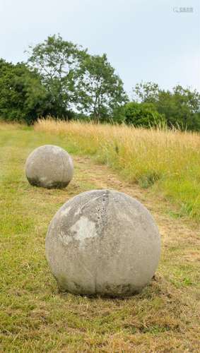 A LARGE PAIR OF STONE COMPOSITION BALLS, 20TH CENTURY