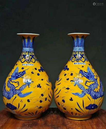 A pair of yellow-ground blue-and-white dragon-patterned jade...