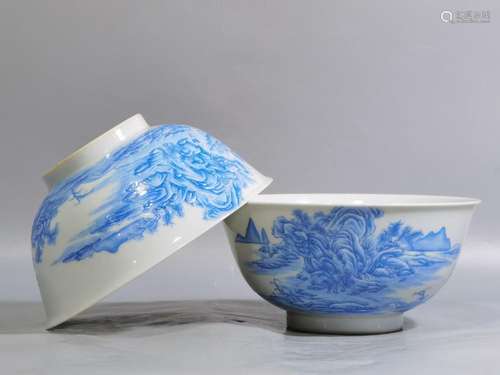 A pair of enamel colored blue landscape landscape bowls