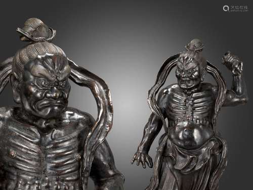 A PAIR OF MONUMENTAL BRONZE NIO GUARDIANS, DATED 1783 BY INS...