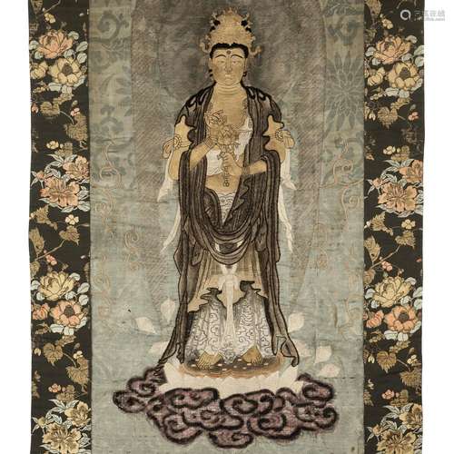 A RARE EMBROIDERED SILK WALL HANGING OF KANNON