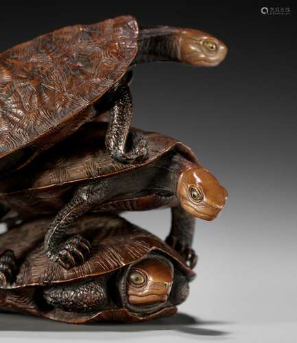 DORAKU: A SUPERB WOOD OKIMONO OF THREE TURTLES