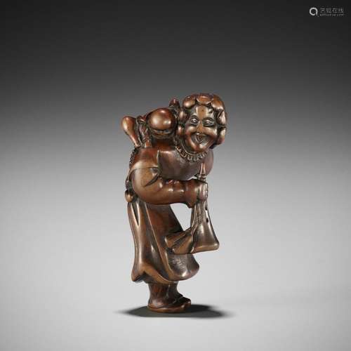 A GOOD WOOD NETSUKE OF A DUTCHMAN WITH CHILD