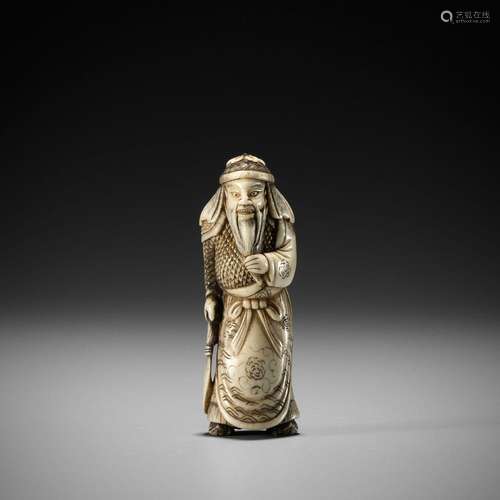 A FINE STAG ANTLER NETSUKE OF KAN`U