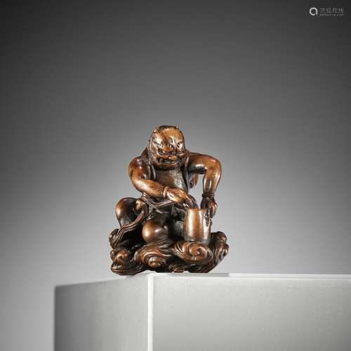 NANMUSAI: A RARE WOOD NETSUKE OF RAIJIN DISCHARGING A STORM