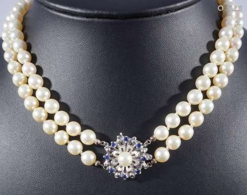 Two-rowed pearl necklaces with 585 gold lock and sapphire, 2...