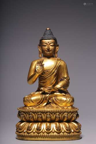 Gilded bronze sitting image of the motionless Tathagata