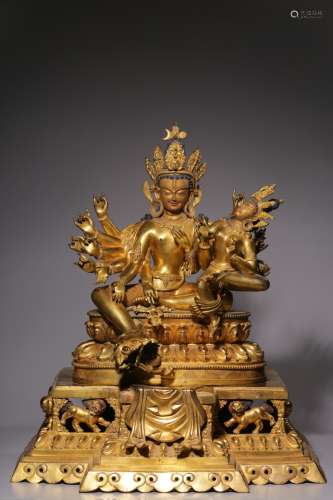 The bronze gilt Buddha with 16 arms and two bodies standing ...