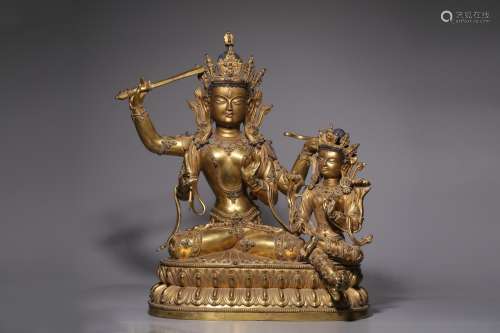 Gilded bronze Manjusri Buddha with four arms and two bodies