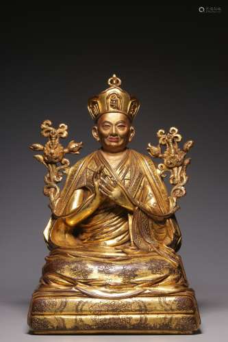 Gilded bronze sitting image of the Master