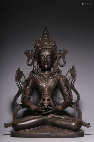 Bronze inlaid silver seated Buddha