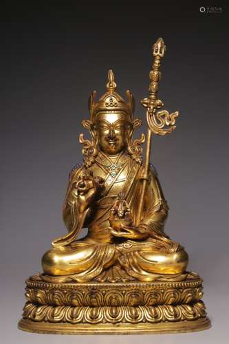 A bronze statue of Peanut sitting in golden lotus