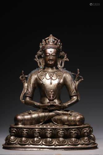 Bronze statue of the Buddha sitting in silver