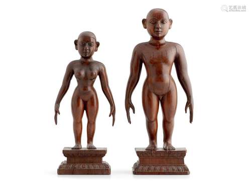 A RARE PAIR OF INDIAN WOODEN FIGURES OF PURUSHA AND PRAKRITI...