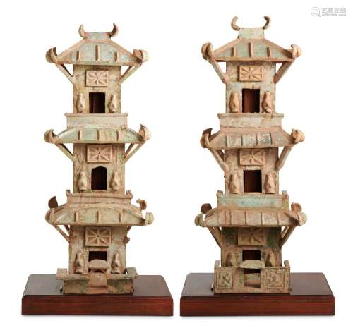 A PAIR OF CHINESE LEAD-GLAZED POTTERY WATCHTOWERS HAN DYNAST...