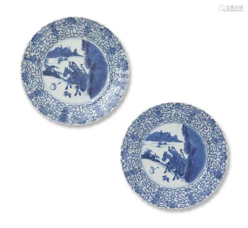A PAIR OF CHINESE BLUE AND WHITE HUNTING DISHES KANGXI PERIO...