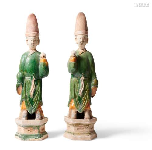 A PAIR OF CHINESE SANCAI MINGQI FIGURES OF MALE ATTENDANTS M...