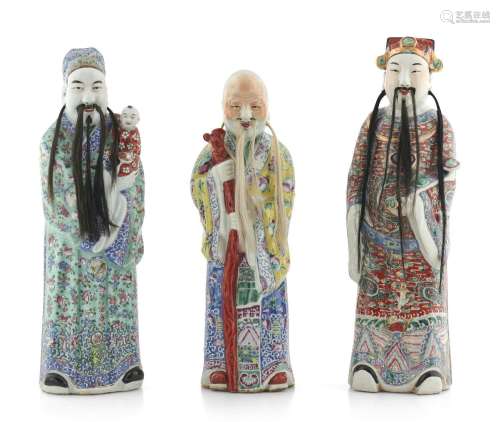 A GROUP OF THREE CHINESE FAMILLE ROSE FIGURES OF FU LU SHOU ...