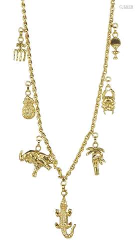 Collier retenant sept pendeloques africaines<br />
Or 750, L...