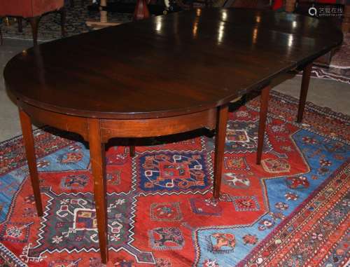 A George III style mahogany D-end dining table,enclosing two...