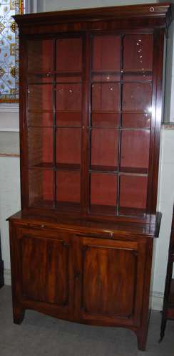 A 19th century mahogany bookcase, the moulded cornice above ...