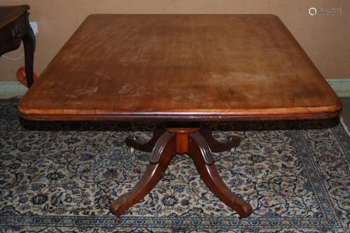 A 19th century mahogany snap top supper table, the hinged ro...
