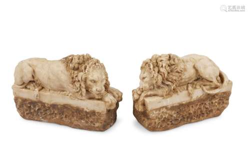 Pair Italian carved reclining lions after the antique