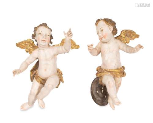 A pair of carved wood polychromed Putti