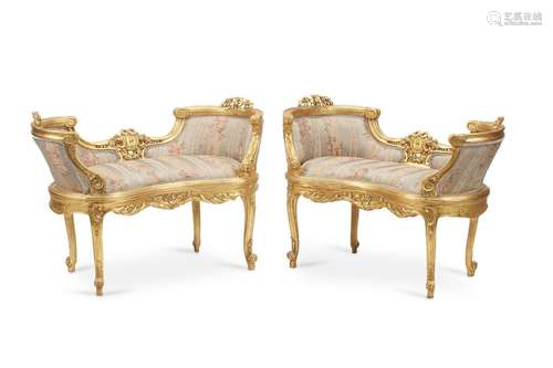 A pair of Louis XV-style giltwood window seats