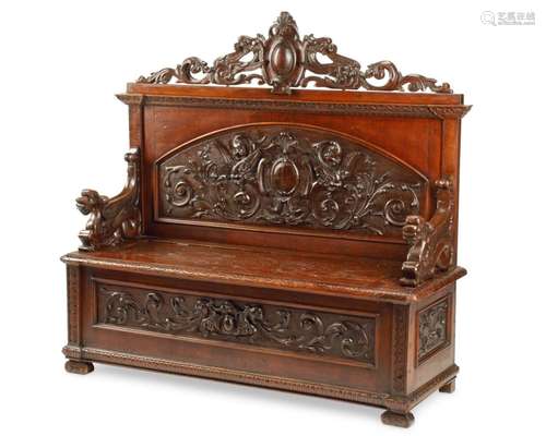 A Renaissance-style carved wood bench