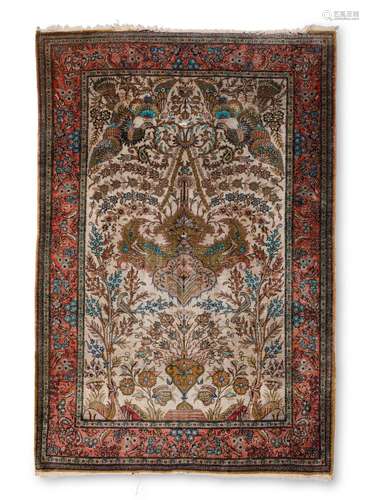 A Persian silk rug