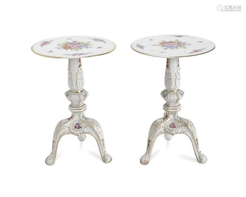 A pair of Sevres-style porcelain tripod tables