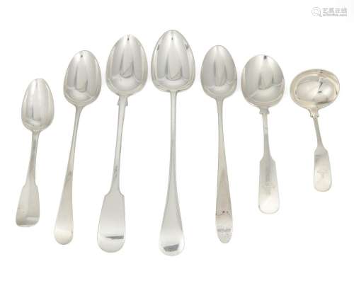 A group of silver flatware