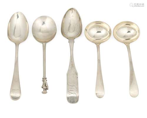 A group of silver flatware