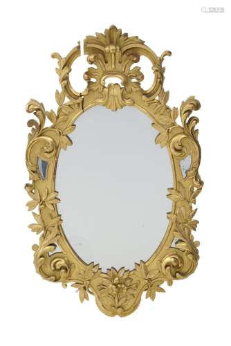 Miroir ovale, XIXe s., en bois sculpté et stuc doré à décor ...