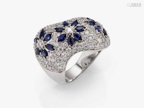 A floral stylized cocktail ring decorated with brilliant-cut...