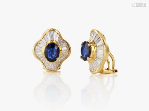 A pair of ear clip / stud earrings with diamonds and sapphir...