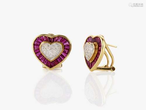 A pair of heart-shaped ear clips / stud earrings with rubies...