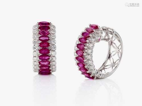 A pair of hoop earrings decorated with rubies and brilliant-...