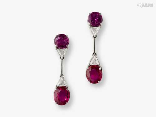 A pair of drop earrings decorated with vivid/deep rubies and...