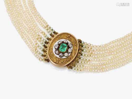 A Collier de Chien of seed pearls with an emerald and diamon...