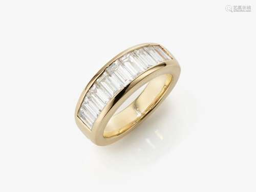 A classic band ring decorated with baguette-cut diamonds - B...