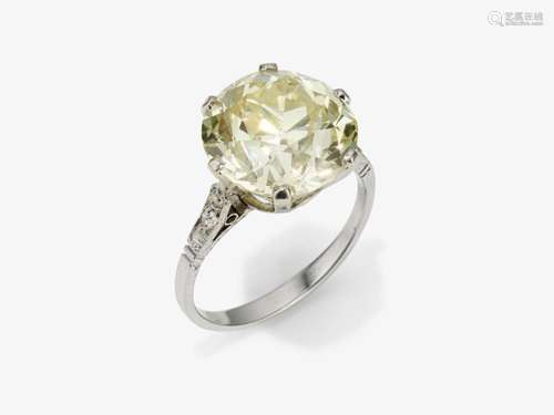 A ring with a large old-brilliant-cut diamond and diamonds -...